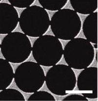 An array of gold nanoparticles in the shape of triangles that are paired in a tip-to-tip formation, like a bow-tie, can serve as optical antennas, capturing and concentrating light waves into well-defined hot spots, where the plasmonic effect is greatly amplified.