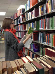 Dayna Topalian, of MSU Libraries, pulls titles to be shipped to Google for digitization. Image credit: Michigan State University