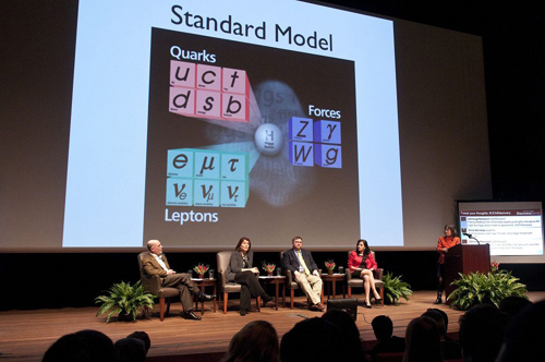 Panelists explain the science behind the Higgs particle, which underpins the so-called Standard Model upon which the modern study of physics is based. Photo by Lloyd DeGrane