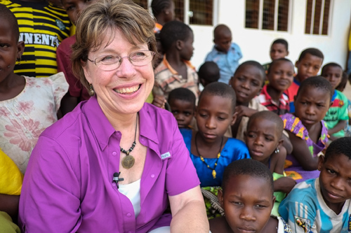 Milola children greet Diane Ruonavaara, project manager for MSU's Tanzanian Partnership Program. Photo by Gabrielle Kleber