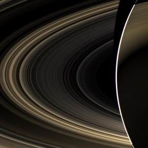 Peering over the shoulder of giant Saturn, through its rings, and across interplanetary space, NASA's Cassini spacecraft spies the bright, cloudy terrestrial planet, Venus. The vast distance from Saturn means that Venus only shows up as a white dot, just above and to the right of the image center. Image credit: NASA/JPL-Caltech/Space Science Institute (Click image to enlarge)