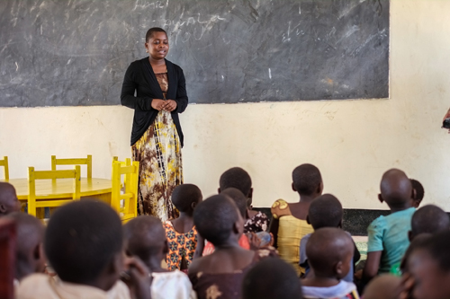 A teacher talks to her students in the new pre-primary school in Ngwenya, a sub-village of Milola. Photo by Gabrielle Kleber