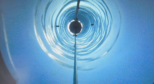 A video camera on a NASA-designed-and-funded mini-submarine captured this view as it descended a 2,600-foot-deep (800-meter-deep) borehole to explore Antarctica's subglacial Lake Whillans. The international Whillans Ice Stream Subglacial Access Research Drilling (WISSARD) project was designed to gain insights into subglacial biology, climate history and modern ice sheet behavior. Image credit: NASA/JPL-Caltech 