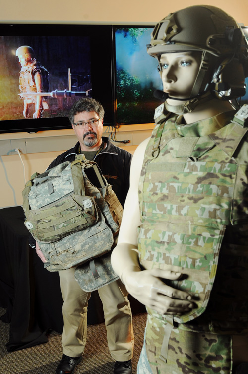 Douglas Woods, GTRI research scientist and IBESS program manager, poses with a mannequin equipped with the Integrated Blast Effect Sensor Suite system. (GT Photo by: Gary Meek)