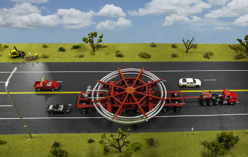A model of the truck that will be used to transport the Muon g-2 ring, placed on a streetscape for scale. The truck will be escorted by police and other vehicles when it moves from Brookhaven National Laboratory in New York to a barge, and then from the barge to Fermi National Accelerator Laboratory in Illinois. Image credit: Fermilab