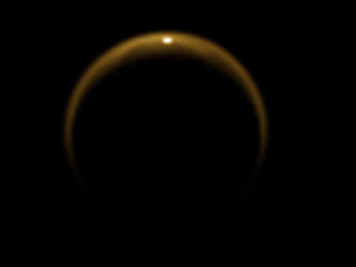 This image shows the first flash of sunlight reflected off a hydrocarbon lake on Saturn's moon Titan. The glint off a mirror-like surface is known as a specular reflection. This kind of glint was detected by the visual and infrared mapping spectrometer (VIMS) on NASA's Cassini spacecraft on July 8, 2009. It confirmed the presence of liquid in the moon's northern hemisphere, where lakes are more numerous and larger than those in the southern hemisphere. Scientists using VIMS had confirmed the presence of liquid in Ontario Lacus, the largest lake in the southern hemisphere, in 2008. Image credit: NASA/JPL/University of Arizona/DLR