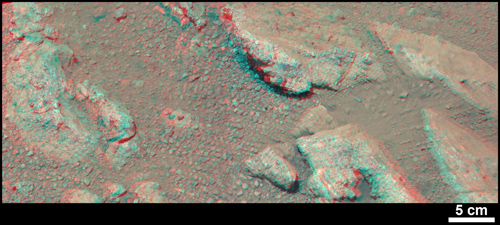 This stereo view from NASA's Mars rover Curiosity shows a rock called "Link," which bears rounded pebbles that provide evidence about vigorous flow of water in a stream on ancient Mars. The scene appears three dimensional when viewed through red-blue glasses with the red lens on the left. The scale bar at lower right is 5 centimeters (2 inches). Image credit: NASA/JPL-Caltech/MSSS