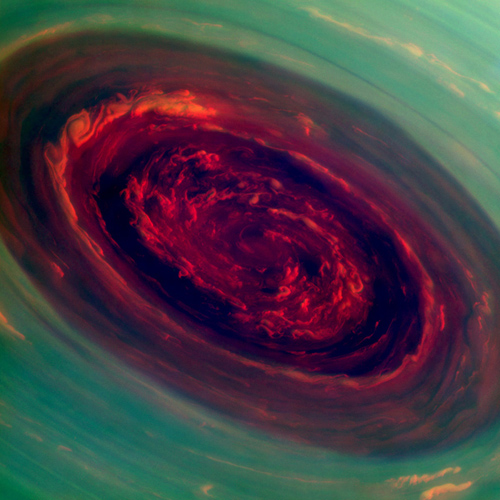 The Rose. The spinning vortex of Saturn's north polar storm resembles a deep red rose of giant proportions surrounded by green foliage in this false-color image from NASA's Cassini spacecraft. Measurements have sized the eye at a staggering 1,250 miles (2,000 kilometers) across with cloud speeds as fast as 330 miles per hour (150 meters per second). Image Credit: NASA/JPL-Caltech/SSI