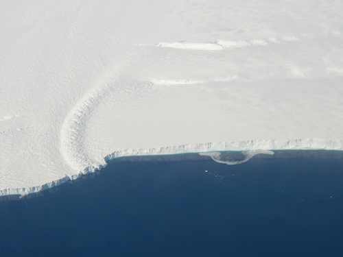 This photo shows the ice front of the ice shelf in front of Pine Island Glacier, a major glacier system of West Antarctica. The image was taken during the NASA/Centro de Estudios Cientificos, Chile (CECS) Antarctic campaign of Fall 2002. Image credit: NASA/JPL-Caltech/UC Irvine