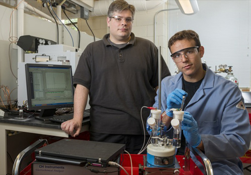 Joel Rosenthal (left) and doctoral student John DiMeglio at work in Rosenthal's lab in the UD Department of Chemistry and Biochemistry. Photo by Kathy F. Atkinson