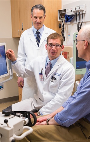 From left) Urologists Peter Schulam and Preston Sprenkle discuss a patient’s case using the Artemis system, which offers new flexibility to men diagnosed with prostate cancer who are not ready to pursue surgical treatment. (Photo by Robert A. Lisak)