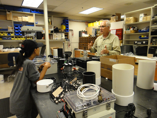 USGS volcano scientist, Andy Lockhart discusses telemetry options with Syegi Kunrat of Indonesia. Image credit: U.S. Geological Survey