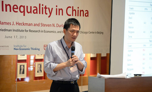 Yang Yao, professor and director of the China Center for Economic Research at Peking University, gave the keynote address at a June 17 conference at the University of Chicago Center in Beijing. Photo by James Withrow