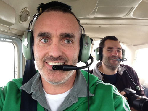 Co-authors Chris Reddy, foreground, and Dave Valentine during an overflight of the affected area in January 2013. (Photo courtesy Chris Reddy, Woods Hole Oceanographic Institution)