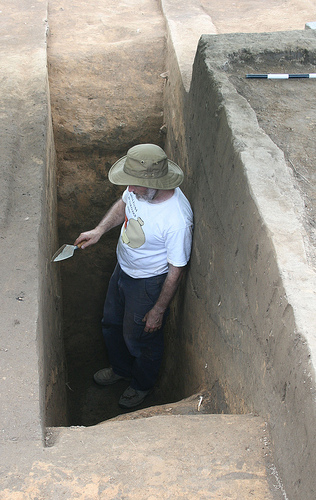 Rob Beck at base of cross-sectioned Spanish moat, moat is 1.7 m (5.5 feet) deep and 4.5 m (15 feet) across