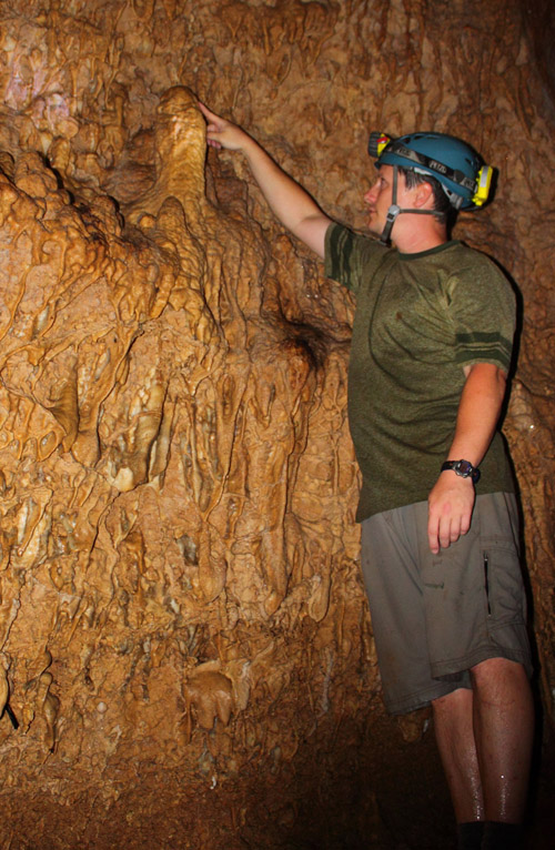 Jud Partin inspects a stalagmite in Taurius Cave on the island of Espiritu Santo, Vanuatu. A stalagmite such as this one could be used in a paleoclimate reconstruction. Image credit: University of Texas at Austin