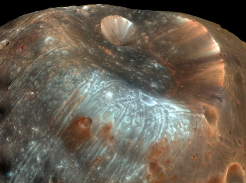 A mysterious little rock in its own right. The Martian moon Phobos has accumulated dust and debris from the surface of Mars, knocked into its orbital path by projectiles colliding with the planet. A sample-return mission to Phobos would thus return material both from Phobos and from Mars. Image credit: NASA 