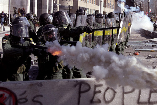 Police fire tear gas. Image source: Wikipedia