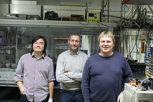 For the first time, scientists at IBM Research have demonstrated a complex quantum mechanical phenomenon known as Bose-Einstein condensation (BEC) using non-crystalline solid materials.The discovery was made using a luminescent polymer (plastic) similar to the materials in light emitting displays used in many of today’s smartphones. This discovery has potential applications in developing novel optoelectronic devices including energy-efficient lasers and optical switches — critical components for future computer systems. The use of a polymer material and the observation of BEC at room temperature provides substantial advantages in terms of applicability and cost. In this photo, the team of IBM scientists (left to right) Lijian Mai, Rainer F Mahrt and Thilo Stoeferle who achieved the Bose-Einstein condensate breakthrough. Photo Credit: IBM Research