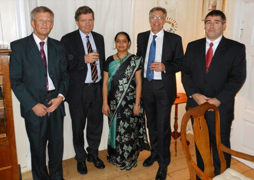 UD's Deni Galileo (far right) at the doctoral dinner for University of Oslo student Mrinal Joel (center). From left are Egil Johnson, acting dean and disputation leader from the University of Oslo; Iver Langmoen, neurosurgeon and Joel's co-adviser; Mrinal Joel; Joel Glover, director of the Norwegian Center for Stem Cell Research at Oslo Universty Hospital; and Galileo. Image credit: University of Delaware