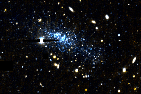 The Leo P dwarf galaxy appears as a spray of blue stars, framed by yellowish foreground stars and background galaxies. Image credit: University of Minnesota
