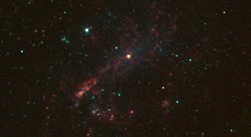 The galaxy NGC 4395 is shown here in infrared light, captured by NASA's Spitzer Space Telescope. Image credit: NASA/JPL-Caltech