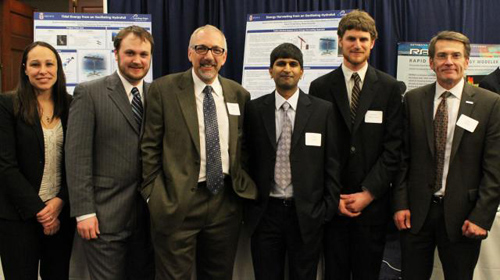 The hydrofoil team presents findings in Washington, D.C. From left: Jennifer Franck, lecturer in engineering; Michael James Miller, grad student; Kenneth Breuer, professor of engineering; Shreyas Mandre, professor of engineering and team leader; Benjamin Strom, research engineer; and Bryan Willson, a program director at the Advanced Research Projects Agency-Energy (ARPA-E). Image credit: Brown University