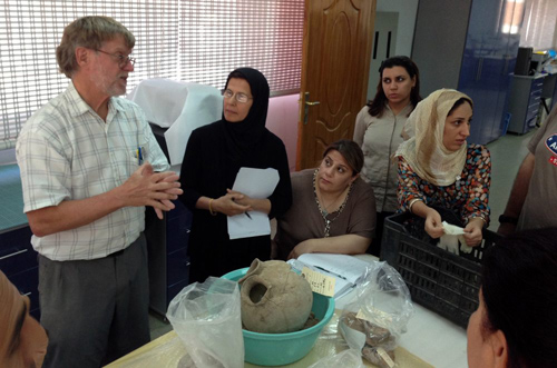 Project ceramics specialist Dr. John Alden discusses the Surezha-excavated ceramics with Iraqi conservators in Erbil. Image courtesy Gil Stein/Oriental Institute