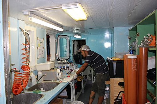 J. Cesar Ignacio Espinoza, a UA doctoral student in Sullivan's lab and co-first author on the Nature paper, in a mobile lab set up on a research cruise to sample viruses in the ocean. (Photo credit: Sullivan lab)