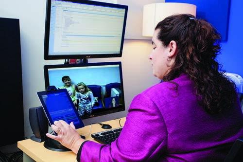 Dr. Felissa Goldstein uses the improved telemedicine system at the Marcus Autism Center. She uses the system for early screening and continuing care for children with autism spectrum disorders. Image credit: Marcus Autism Center/ChoA