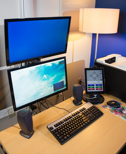 GTRI scientists developed a streamlined, ergonomic telemedicine system. Now the monitor that displays medical records is above the patient monitor, with a powerful webcam positioned in the space between the monitors. An iPad controls the system. Image credit: GTRI