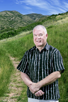 Geophysicist Phil Wannamaker, of the Energy & Geoscience Institute at the University of Utah, stands in the foothills above the campus. Wannamaker conceived and co-authored a new study providing the clearest look yet at the underground system that generates molten rock where two of Earth’s tectonic plates collide, then sends it upward to the magma chamber beneath 14,410-foot Mount Rainier, the tallest volcano in the Cascade Range and in Washington state. Photo Credit: Nick Steffens, University of Utah Marketing and Communications