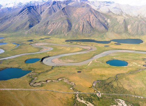 Arctic lakes and Atigun River on Alaska’s North Slope. The Dalton Highway and the trans-Alaska pipeline can be seen near the bottom of the image. Image credit: George W. Kling