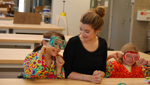 Olivia Pavco-Giaccia's sparkly goggles and colorful lab coats come with a storybook about a young girl who loves science. Image credit: Yale University