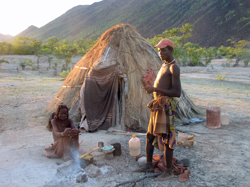 A couple from Namibia’s Twe tribe outside their home. University of Utah anthropologists studied the Twe and Tjimba people of Namibia in a study that linked better spatial skills in men to the distances over which they roam. The study indicated men evolved better navigation skills than women because it helps them find more mates and produce more offspring. Photo Credit: Layne Vashro, University of Utah