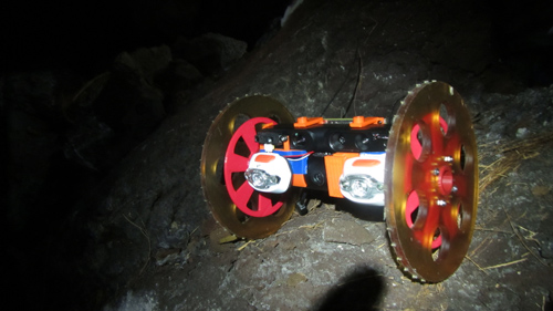 VolcanoBot 1, shown here in a lava tube -- a structure formed by lava -- explored the Kilauea volcano in Hawaii in May 2014. The robot is enabling researchers at NASA's Jet Propulsion Laboratory to put together a 3-D map of the fissure. Image credit: NASA/JPL-Caltech