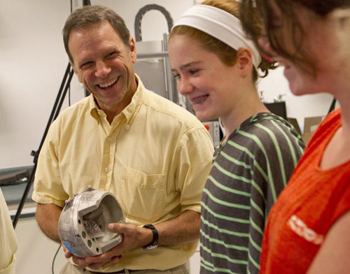 LAX lab. Trey Crisco invited lacrosse-playing girls to the lab to measure the impact of their blows as they whacked the head of a laboratory dummy — and to evaluate the performance of protective headgear. Photo credit: Mike Cohea/Brown University