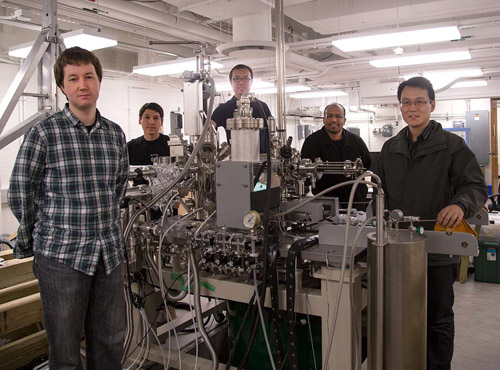 An international team led by Princeton University scientists has discovered Weyl fermions, elusive massless particles theorized 85 years ago that could give rise to faster and more efficient electronics because of their unusual ability to behave as matter and antimatter inside a crystal. The team included numerous researchers from Princeton's Department of Physics, including (from left to right) graduate students Ilya Belopolski and Daniel Sanchez; Guang Bian, a postdoctoral research associate; corresponding author M. Zahid Hasan, a Princeton professor of physics who led the research team; and associate research scholar Hao Zheng. (Photo by Danielle Alio, Office of Communications)