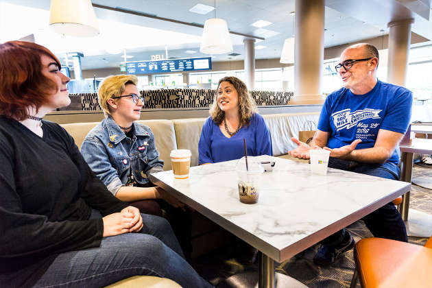 Katie Stone Perez and Chris Charla mentoring two young game developers. Photo by Brian Smale / © Microsoft