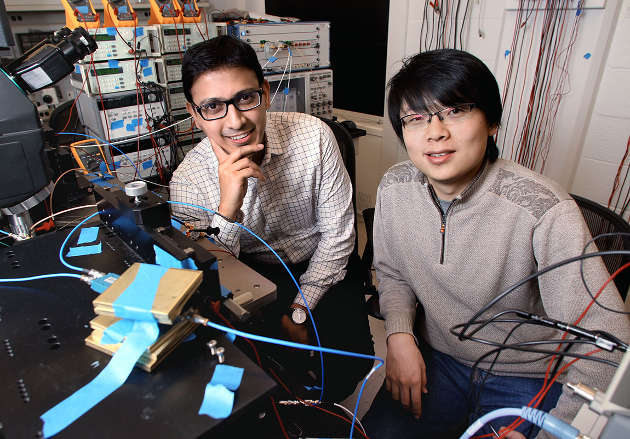 In two recently published articles, researchers Kaushik Sengupta (left), an assistant professor of electrical engineering, and Xue Wu (right), a Princeton graduate student in electrical engineering, describe one microchip that can generate terahertz waves, and a second chip that can capture and read intricate details of these waves. Terahertz waves sit between the microwave and infrared light wavebands on the electromagnetic spectrum and have unique characteristics, such as the ability to pass through most non-conducting material such as clothing or boxes without damaging human tissue or DNA. (Photo by Frank Wojciechowski for the Office of Engineering Communications)