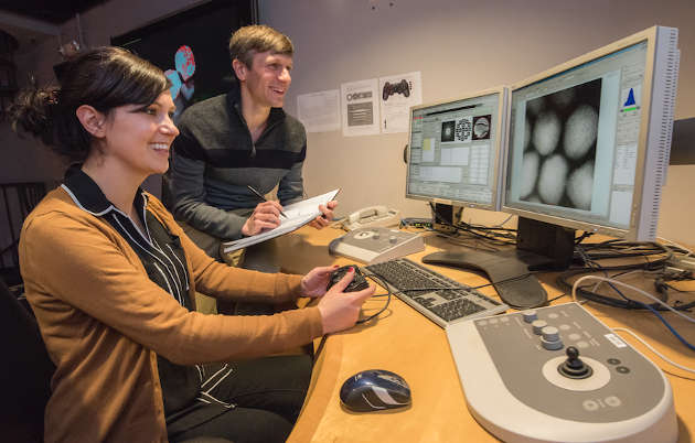 Mary Scott (left) and Peter Ercius at the controls of the TEAM microscope at the Molecular Foundry’s National Center for Electron Microscopy. (Image credit: Marilyn Chung)