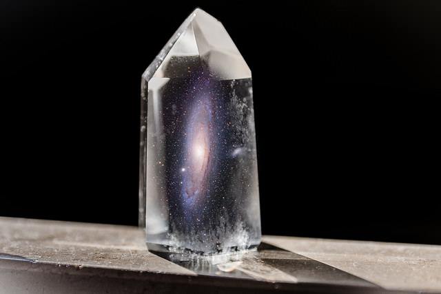 The universe in a crystal. An international team of scientists have verified a fundamental effect in a crystal that had been previously only thought to be observable in the deep universe. The experiments have verified a quantum anomaly that had been experimentally elusive before. The results are appearing in the journal Nature. Image Credit: Robert Strasser, Kees Scherer; collage: Michael Büker