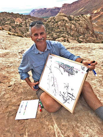 Paleofluids collaborator and structural geologist Bob Krantz reviews Paradox Basin tectonic history overlooking the Moab Fault. (Photo credit: Peter Reiners)