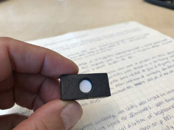 A small domino-sized cartridge holds a membrane for a new field test for liver cancer developed by researchers from the University of Utah. The test doesn’t involve sending a specimen to a blood lab and cuts the wait time for results from two weeks to two minutes. It can be administered wherever the patient is, which will be valuable for developing nations with little access to hospitals. PHOTO CREDIT: University of Utah College of Engineering