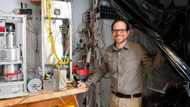 Andrew Grieshop with some of the equipment used to conduct this study.  Image credit: North Carolina State University