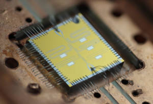 The multi-qubit chip has five superconducting transmon qubits and associated readout resonators. When cooled to absolute zero, such a device can compute things like quantum simulations of advanced materials. Qubit chip image courtesy of the Quantum Nanoelectronics Laboratory, UC Berkeley. 
